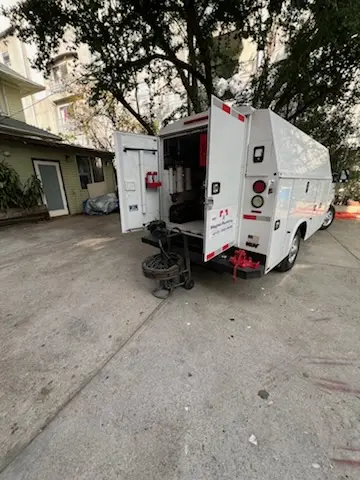 Magnet Plumbing service vehicle on-site for Grease Trap Cleaning in The Gables